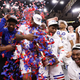 The Kansas Jayhawks celebrate after defeating the Miami (Fl) Hurricanes during the Elite Eight round of the 2022 NCAA Mens Basketball Tournament held at the United Center in Chicago.